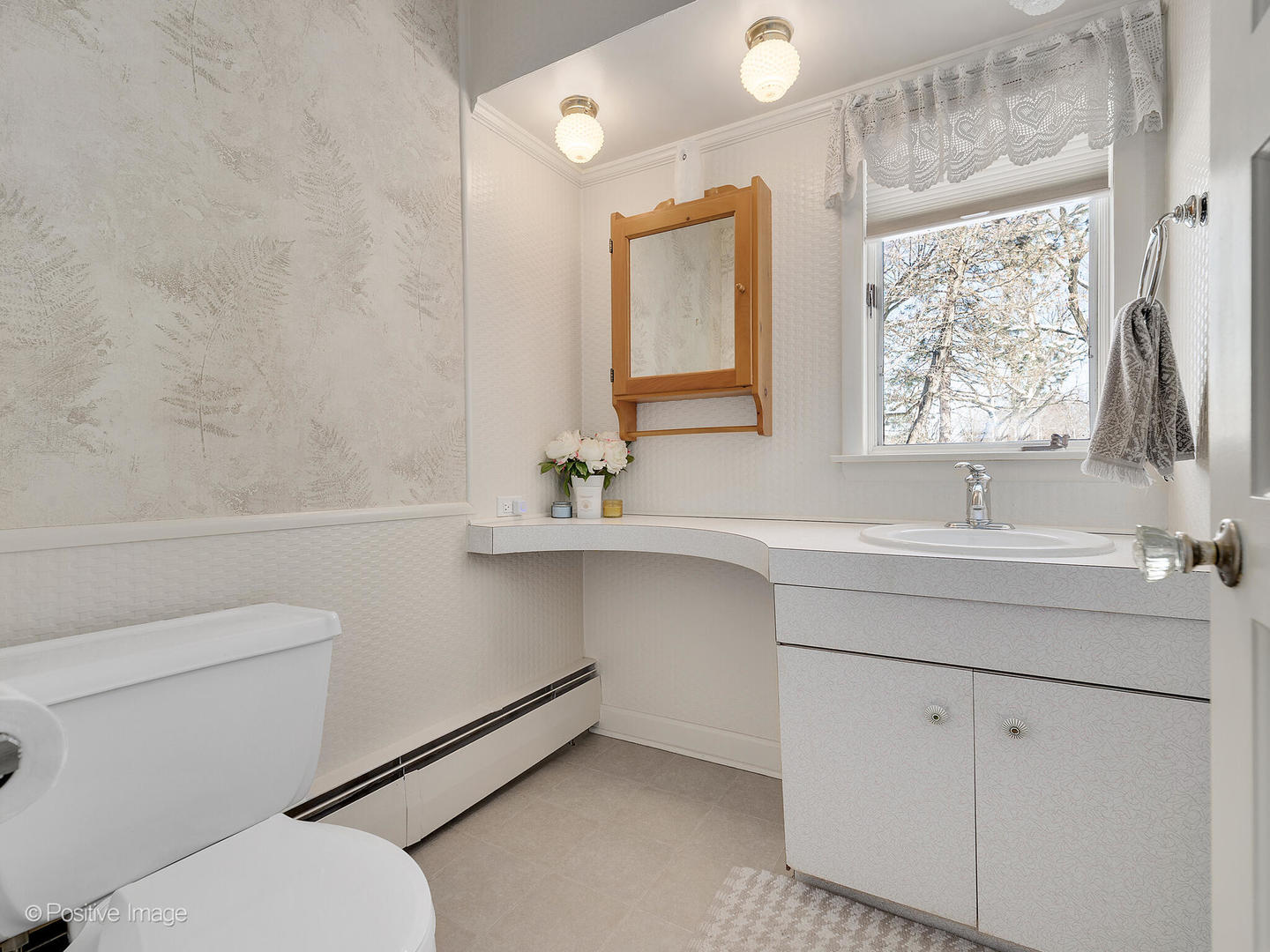 213 Woodside Road Riverside, IL 60546 - Photo 21 of 35 a bathroom with a toilet sink and mirror