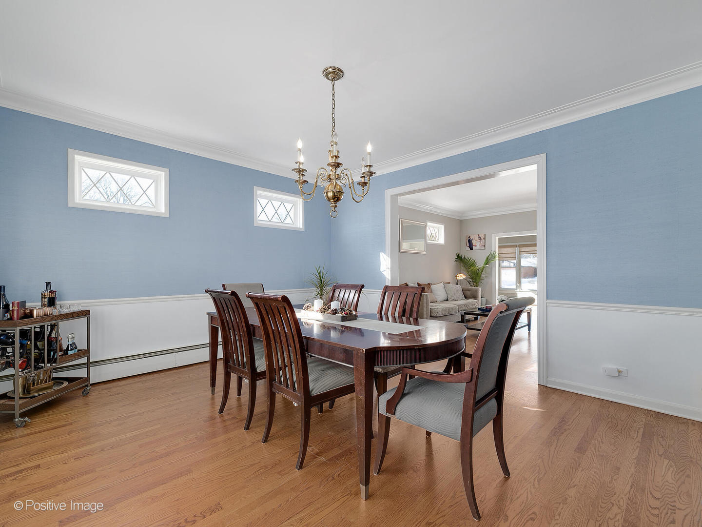 213 Woodside Road Riverside, IL 60546 - Photo 10 of 35 a view of a dining room with furniture wooden floor and chandelier