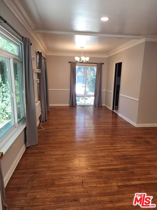 127 North Clark Drive Beverly Hills, CA 90211 - Photo 8 of 9 a view of empty room with wooden floor and fan