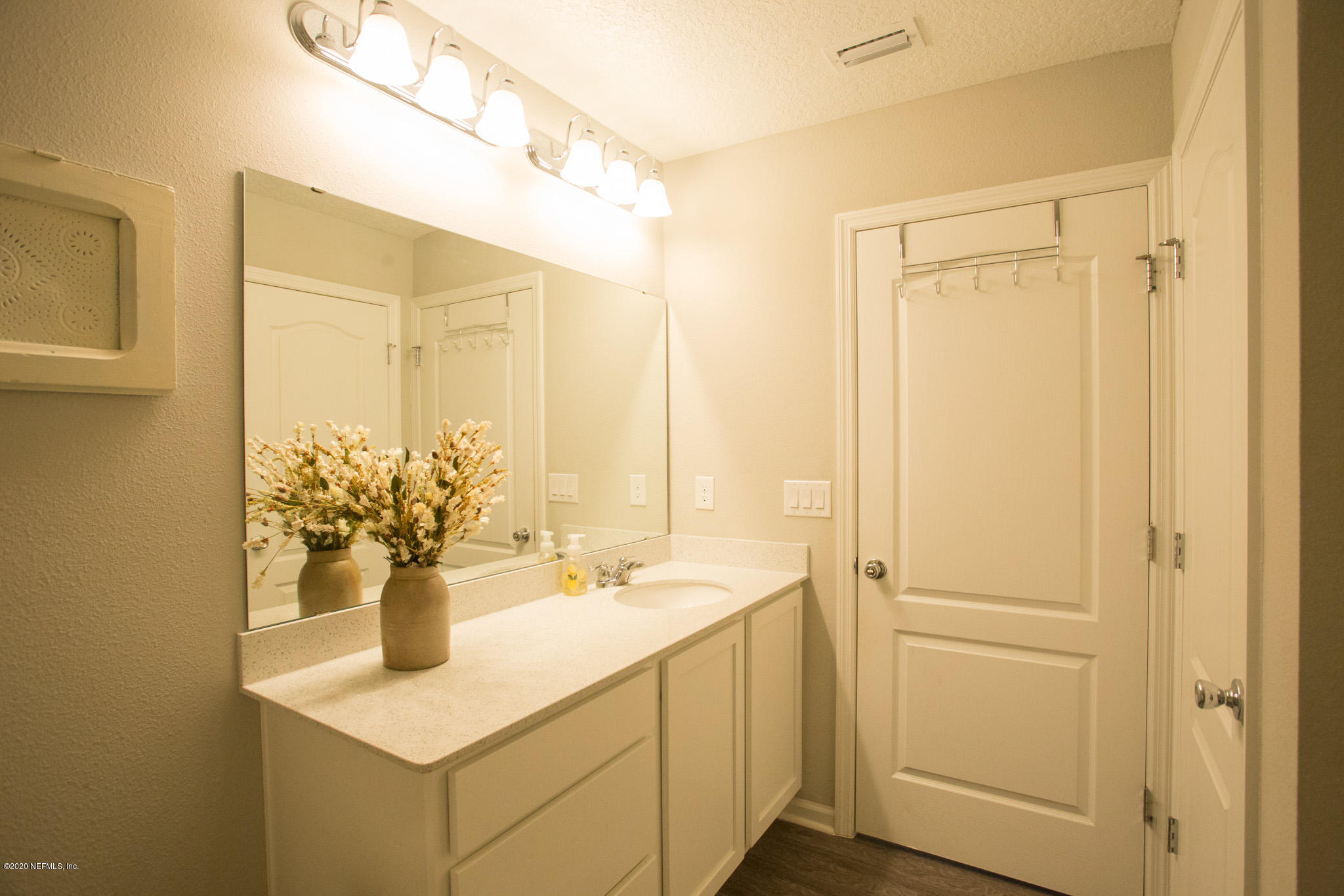 92 Bluejack Lane St. Augustine, FL 32095 - Photo 12 of 44 a bathroom with a sink and a mirror