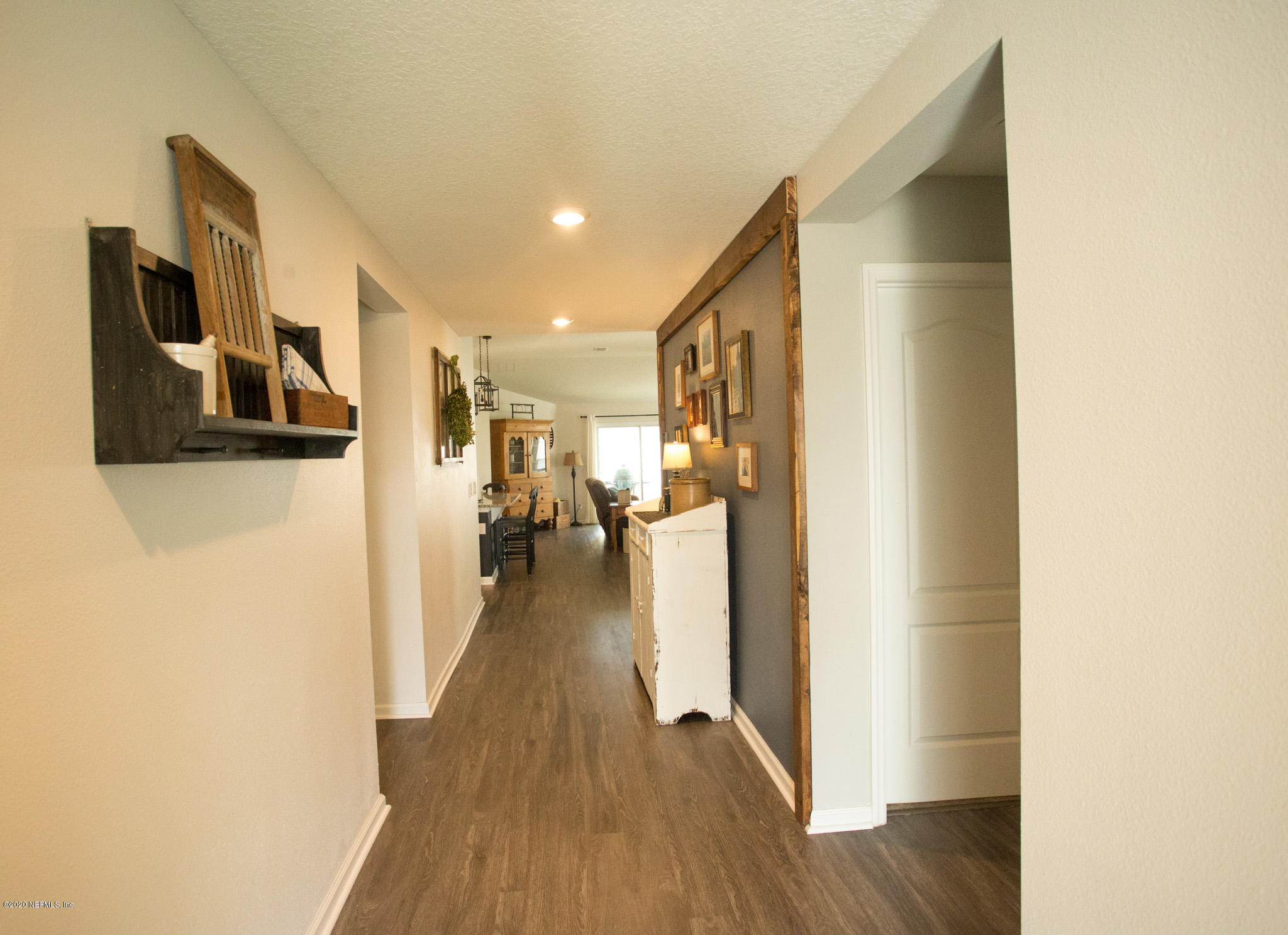 92 Bluejack Lane St. Augustine, FL 32095 - Photo 13 of 44 a view of a hallway with wooden floor