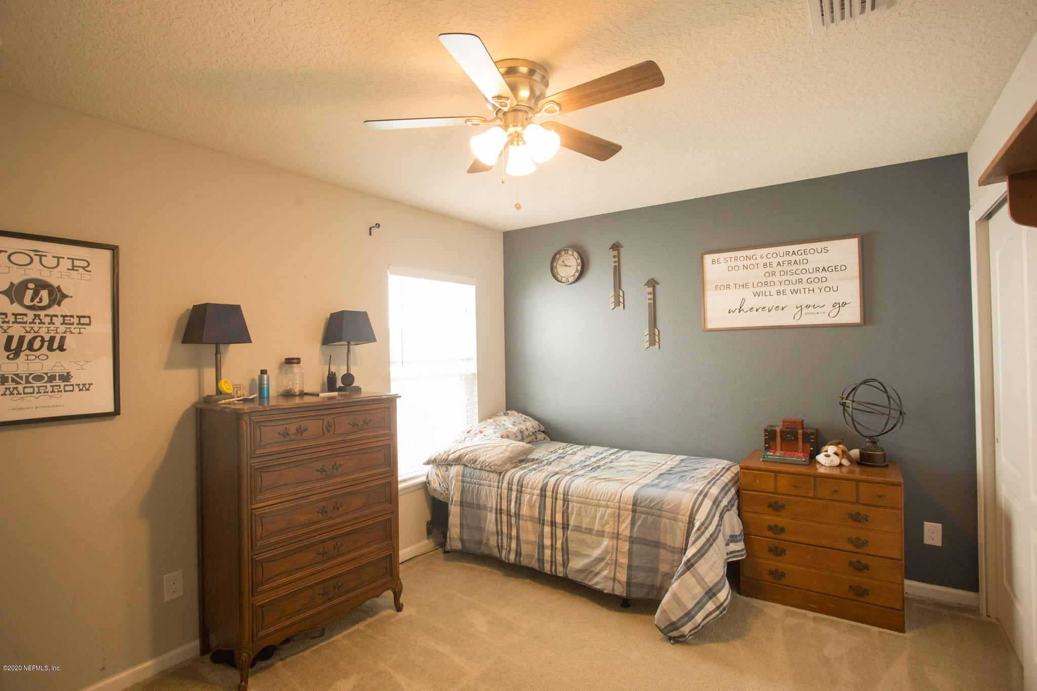 92 Bluejack Lane St. Augustine, FL 32095 - Photo 16 of 44 a bedroom with a bed and ceiling fan