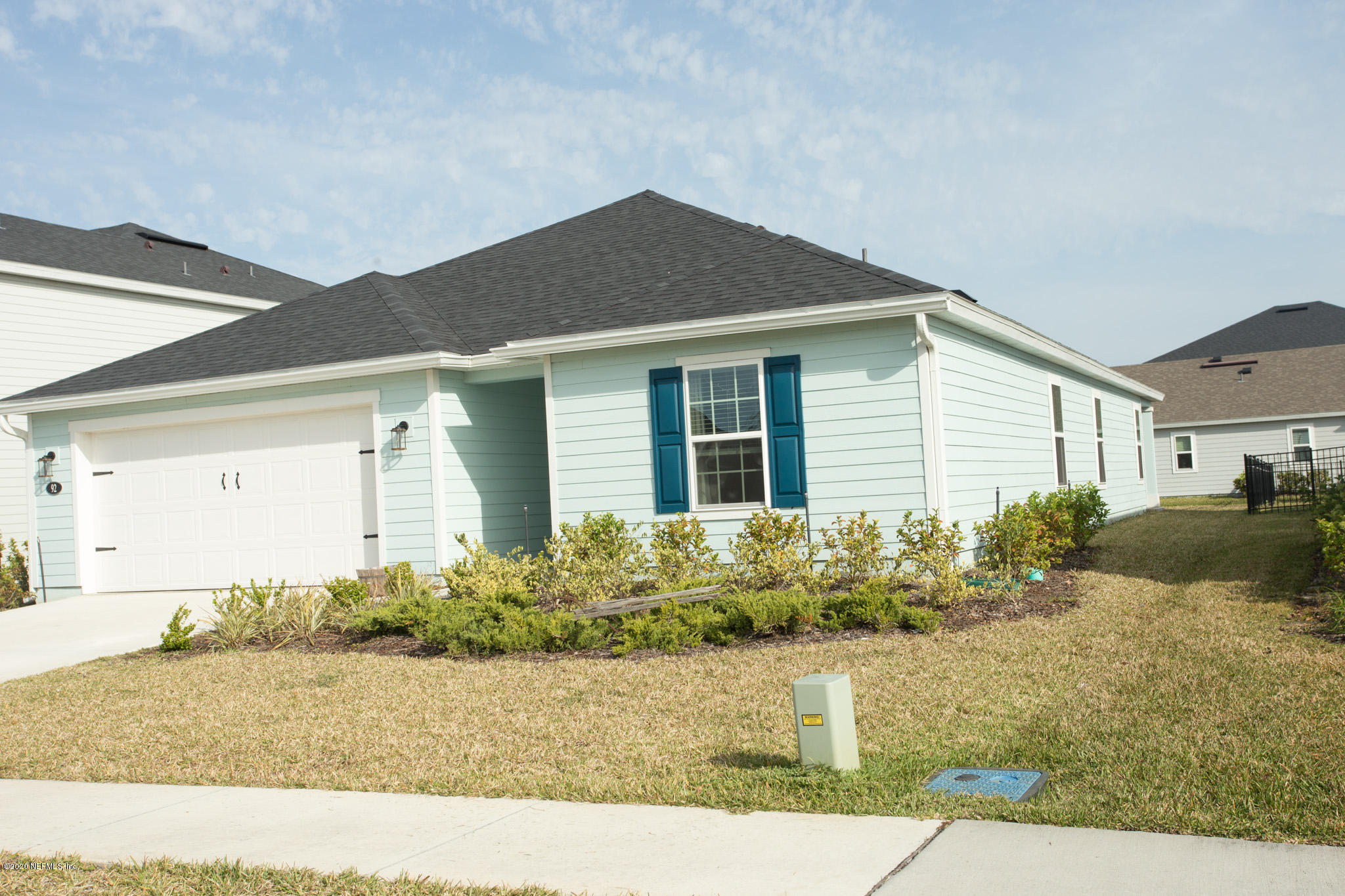 92 Bluejack Lane St. Augustine, FL 32095 - Photo 2 of 44 a front view of a house with garden
