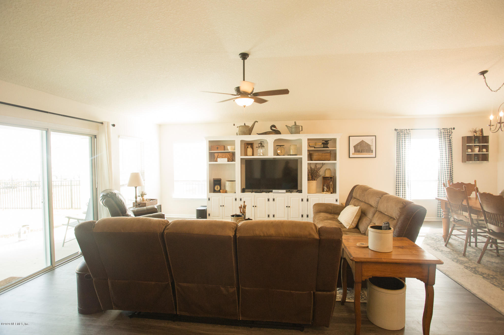 92 Bluejack Lane St. Augustine, FL 32095 - Photo 22 of 44 a living room with furniture window and wooden floor