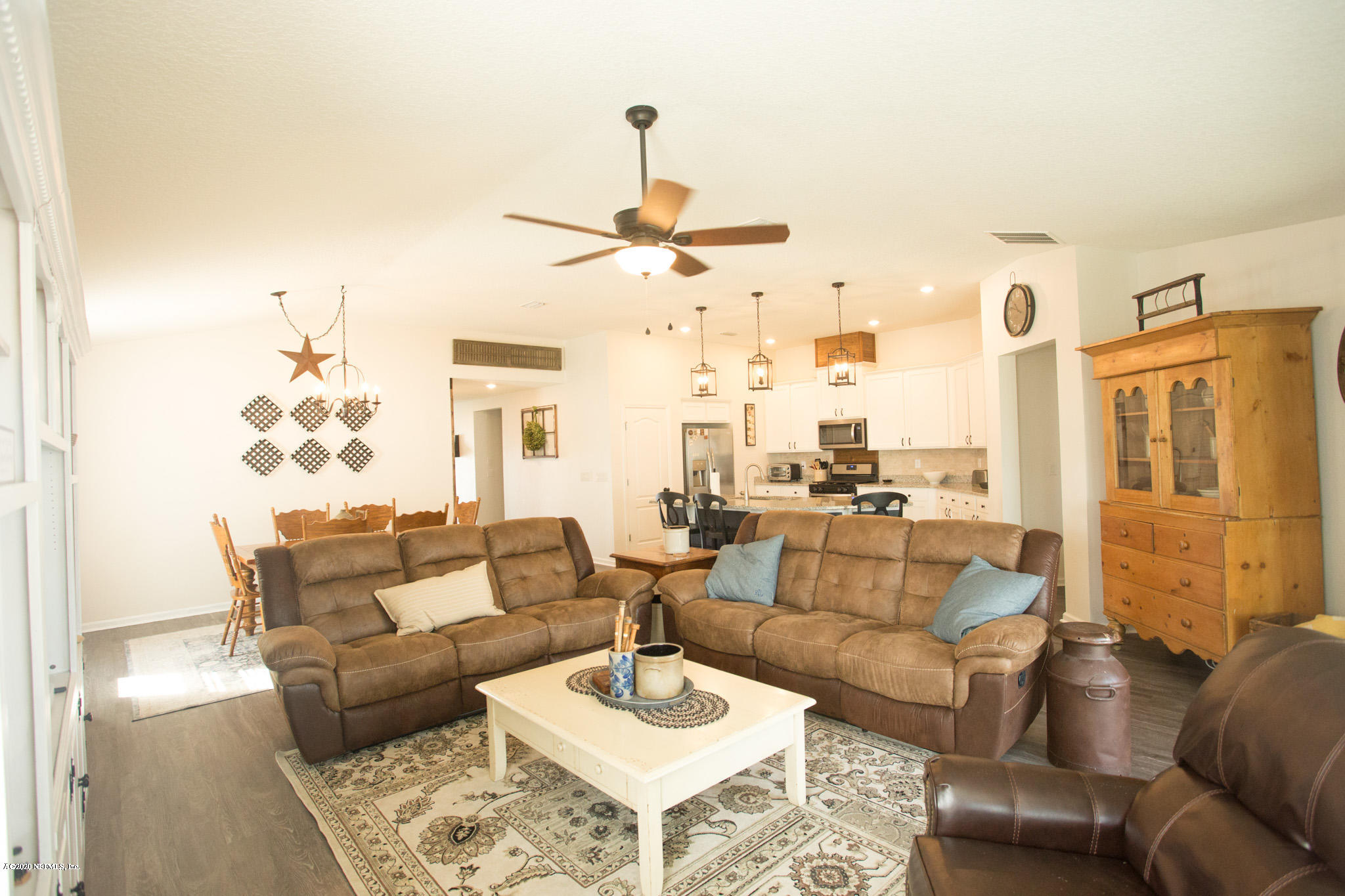 92 Bluejack Lane St. Augustine, FL 32095 - Photo 23 of 44 a living room with furniture or chandelier and a table