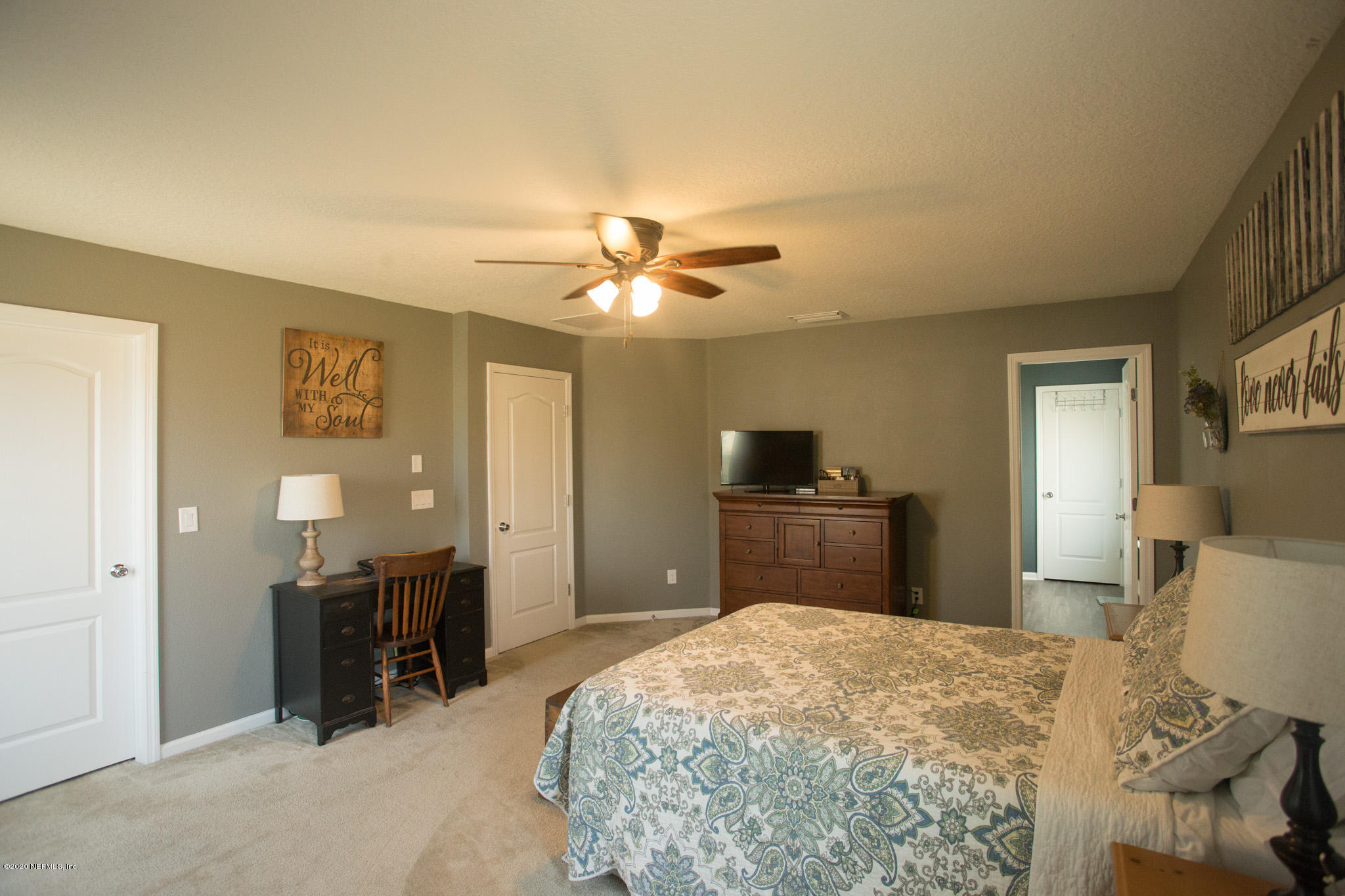 92 Bluejack Lane St. Augustine, FL 32095 - Photo 29 of 44 a bedroom with a bed and a television