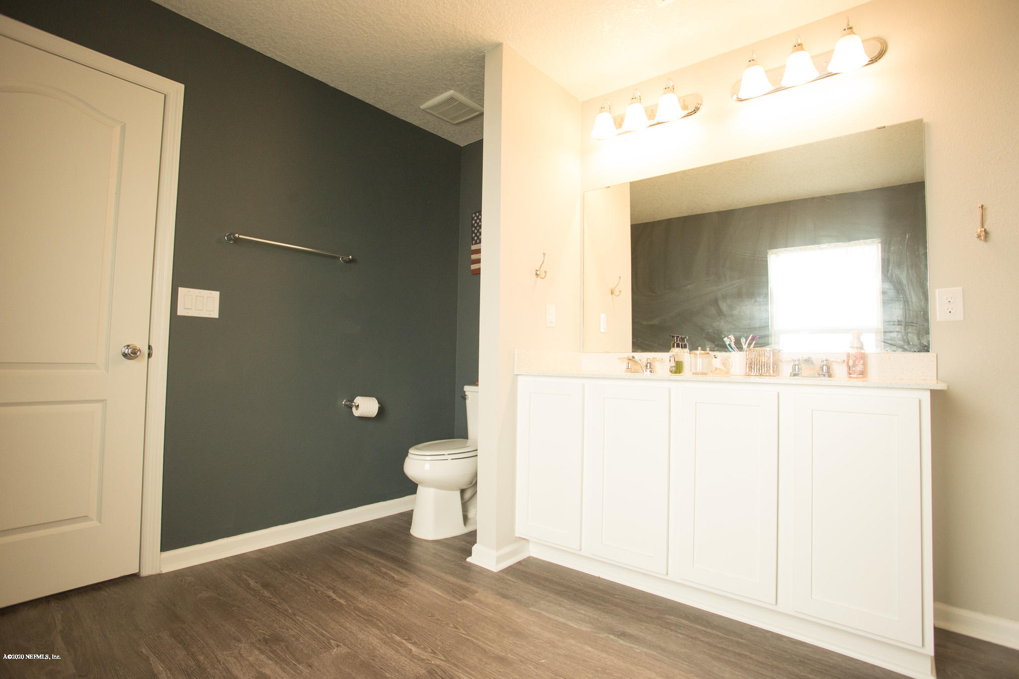 92 Bluejack Lane St. Augustine, FL 32095 - Photo 31 of 44 a bathroom with a sink and a mirror