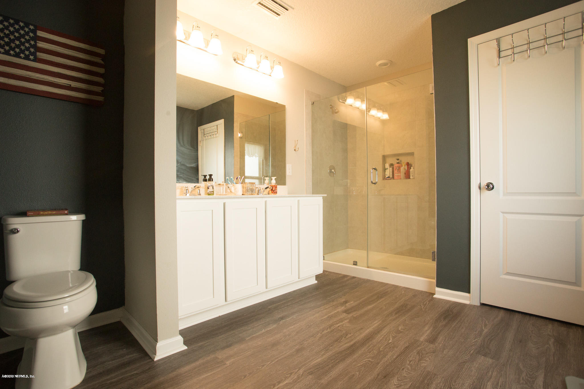 92 Bluejack Lane St. Augustine, FL 32095 - Photo 32 of 44 a bathroom with a toilet and a mirror