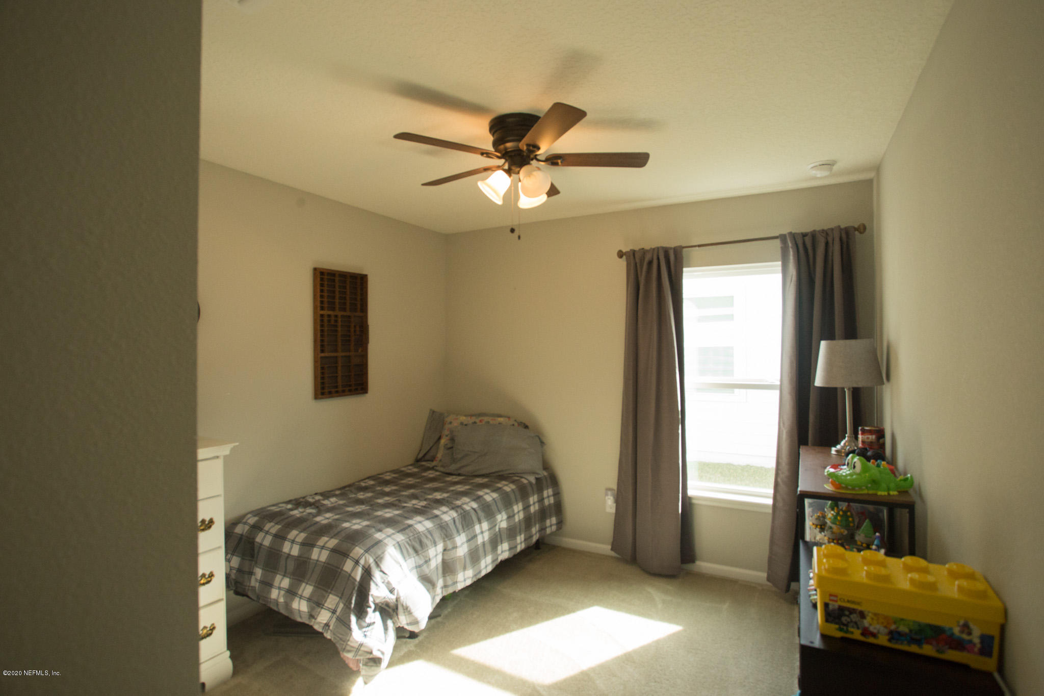 92 Bluejack Lane St. Augustine, FL 32095 - Photo 5 of 44 a bedroom with a bed and a window