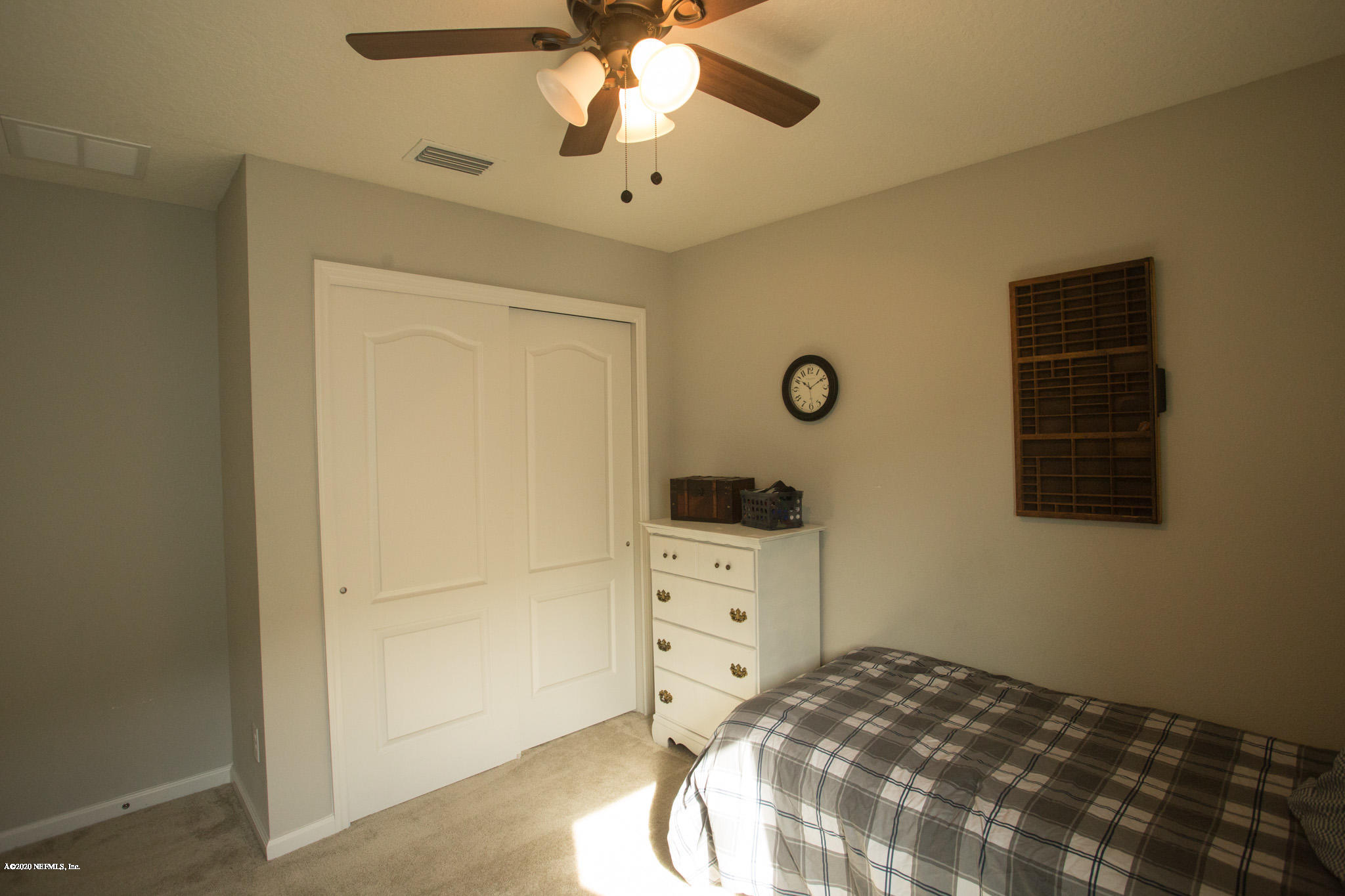 92 Bluejack Lane St. Augustine, FL 32095 - Photo 7 of 44 a bedroom with a bed and a ceiling fan