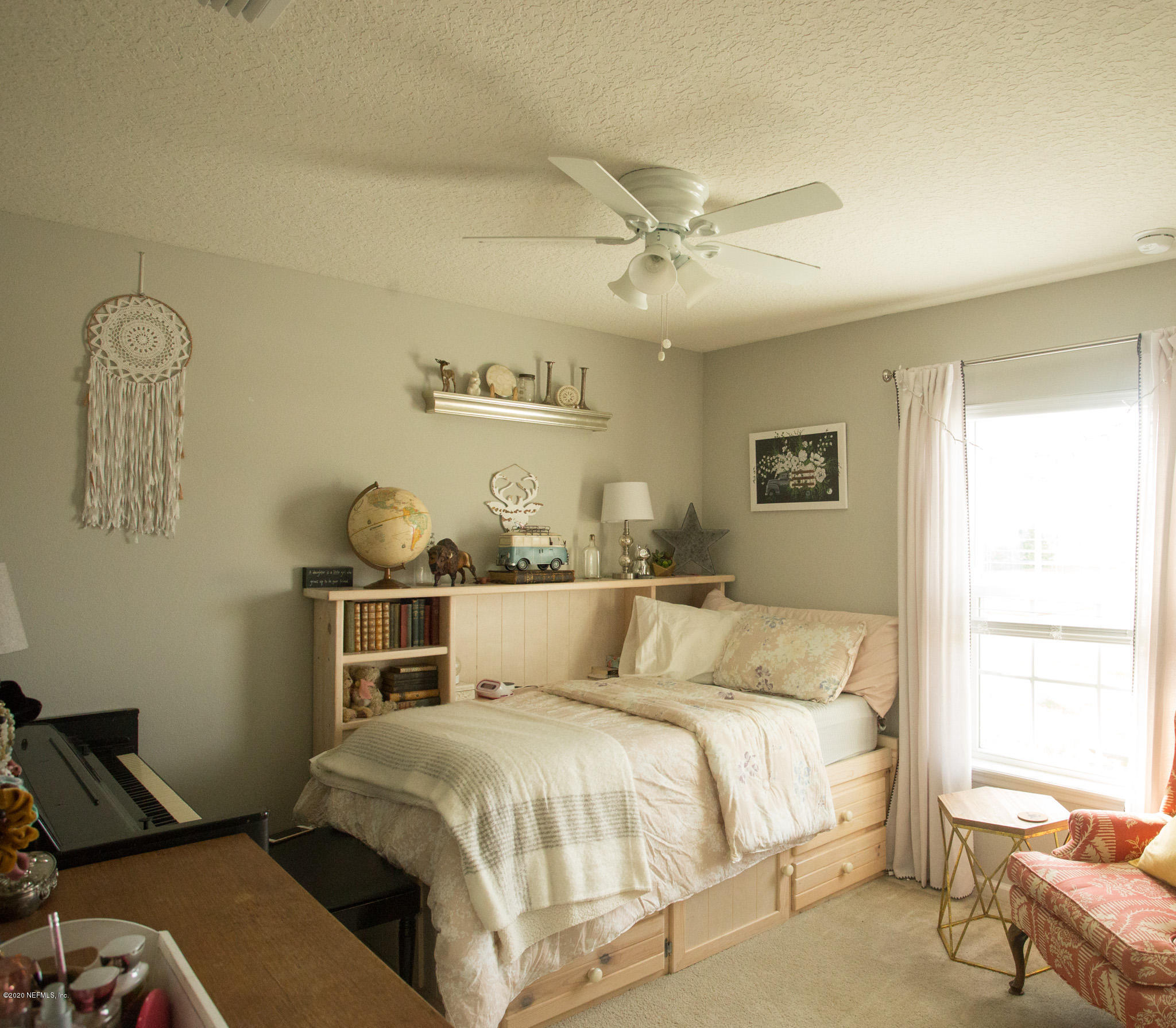 92 Bluejack Lane St. Augustine, FL 32095 - Photo 8 of 44 a bed room with a bed and a window