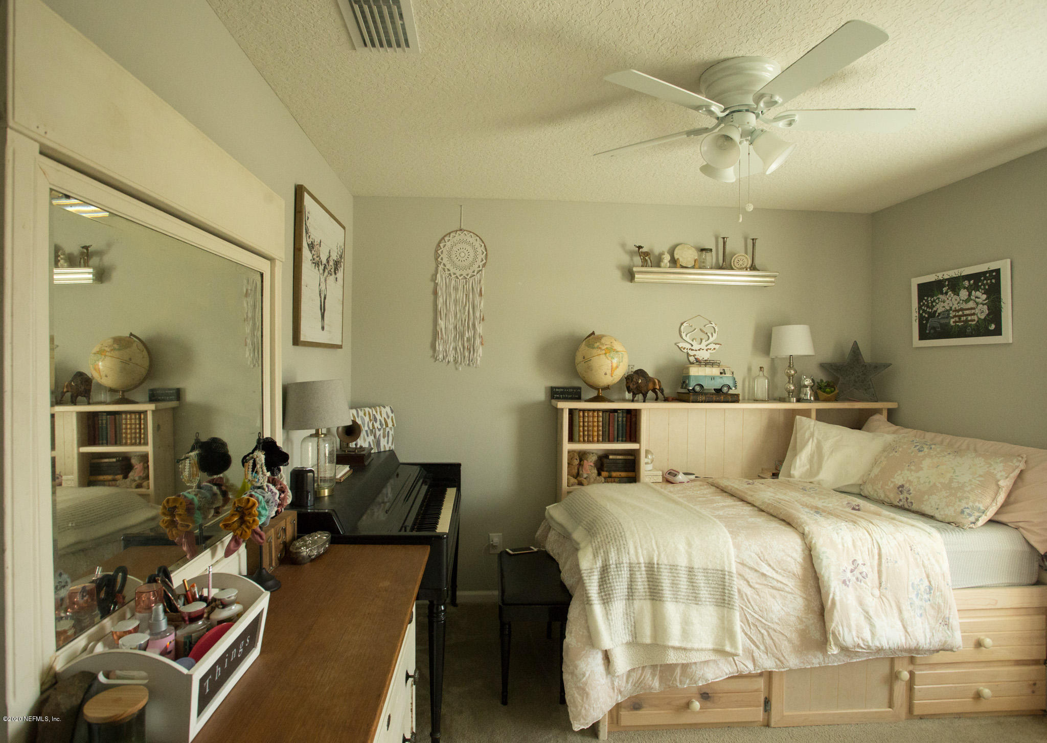 92 Bluejack Lane St. Augustine, FL 32095 - Photo 9 of 44 a bed room with two bed and a chandelier