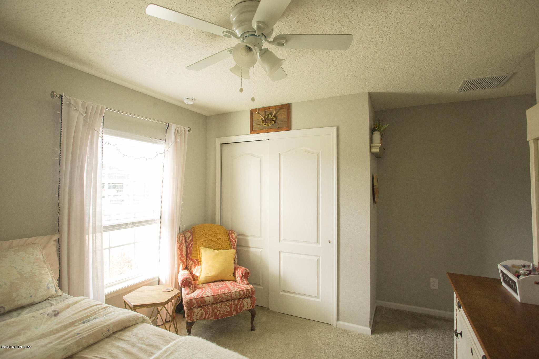 92 Bluejack Lane St. Augustine, FL 32095 - Photo 10 of 44 a living room with furniture and a window