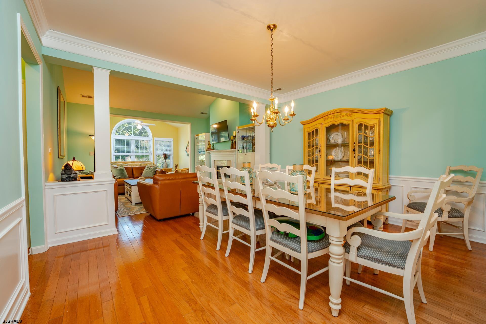 1731 Highway 9, Unit 28 Ocean View, NJ 08230 - Photo 12 of 41 a view of a dining room with furniture wooden floor and chandelier