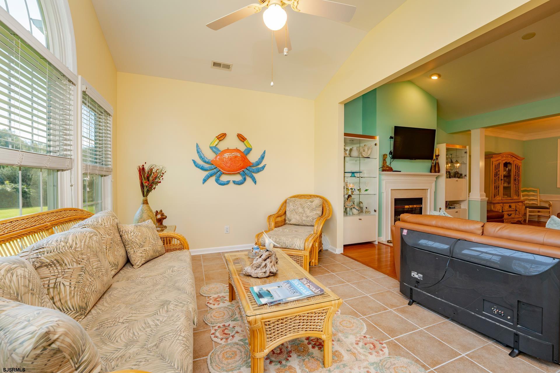 1731 Highway 9, Unit 28 Ocean View, NJ 08230 - Photo 15 of 41 a living room with furniture a flat screen tv and a fireplace