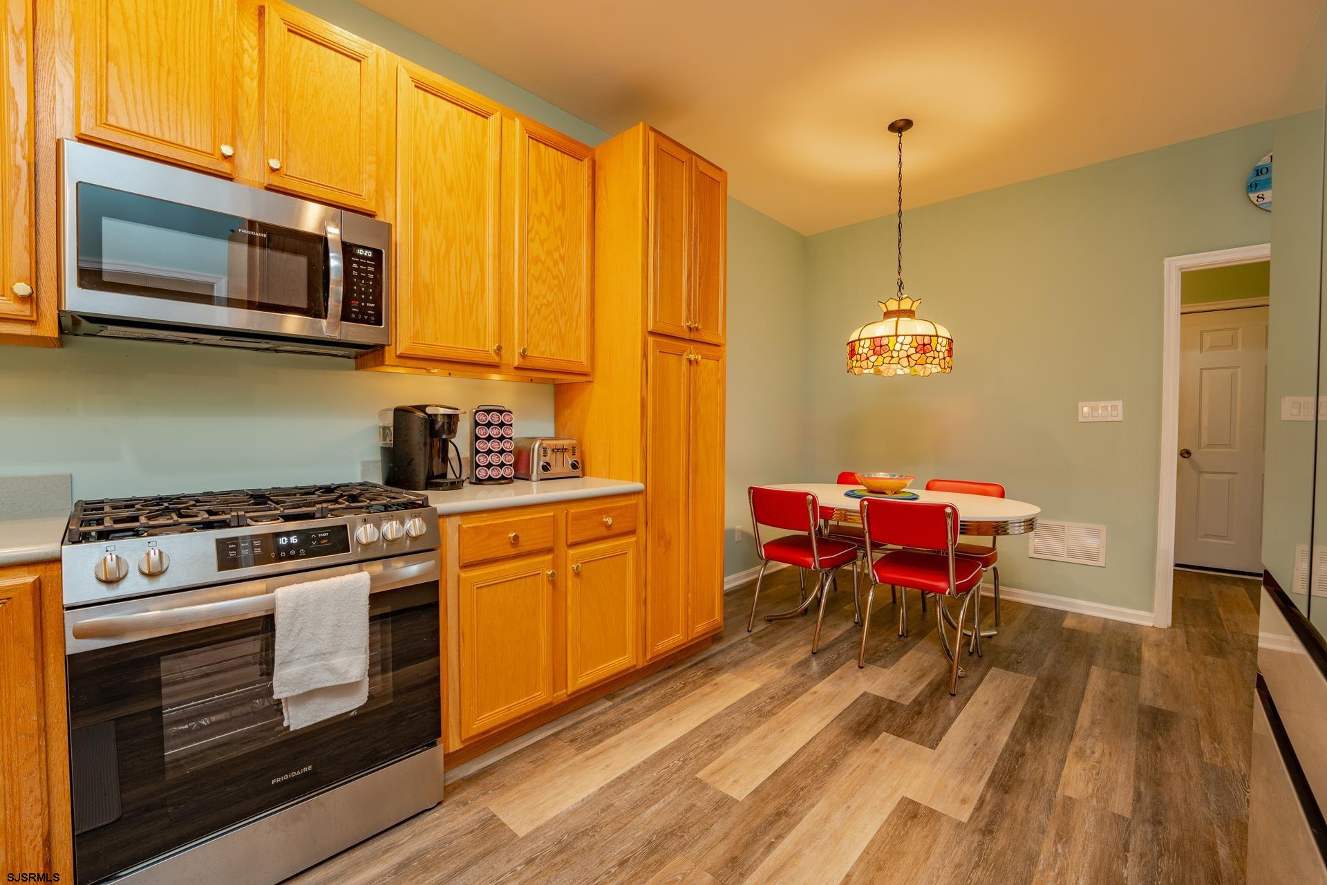 1731 Highway 9, Unit 28 Ocean View, NJ 08230 - Photo 16 of 41 a kitchen with stainless steel appliances granite countertop a stove a sink dishwasher a microwave oven with granite countertops and cabinets