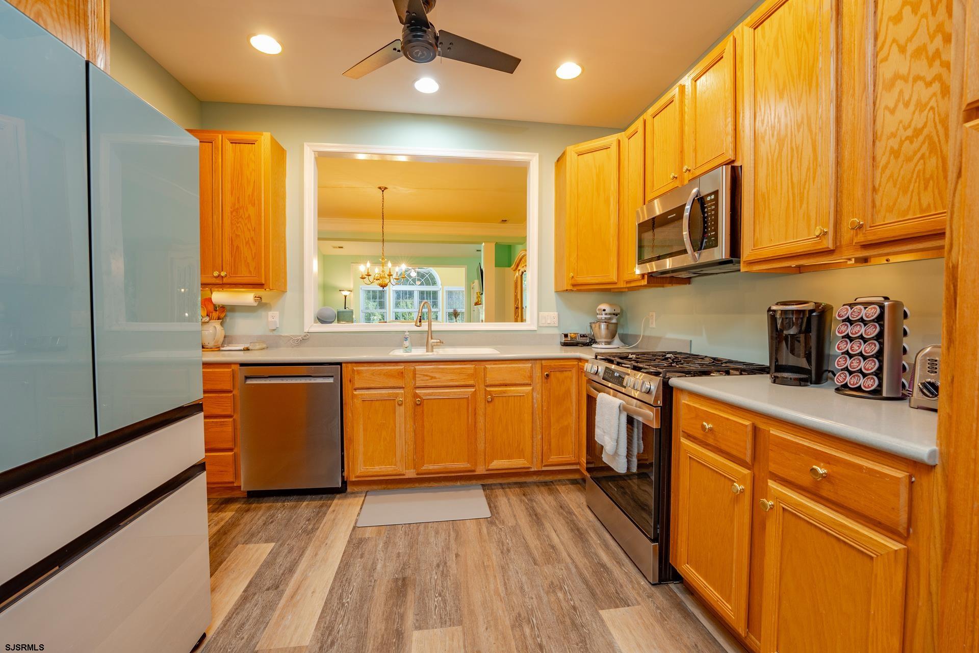 1731 Highway 9, Unit 28 Ocean View, NJ 08230 - Photo 17 of 41 a kitchen with stainless steel appliances granite countertop a stove a sink and a refrigerator