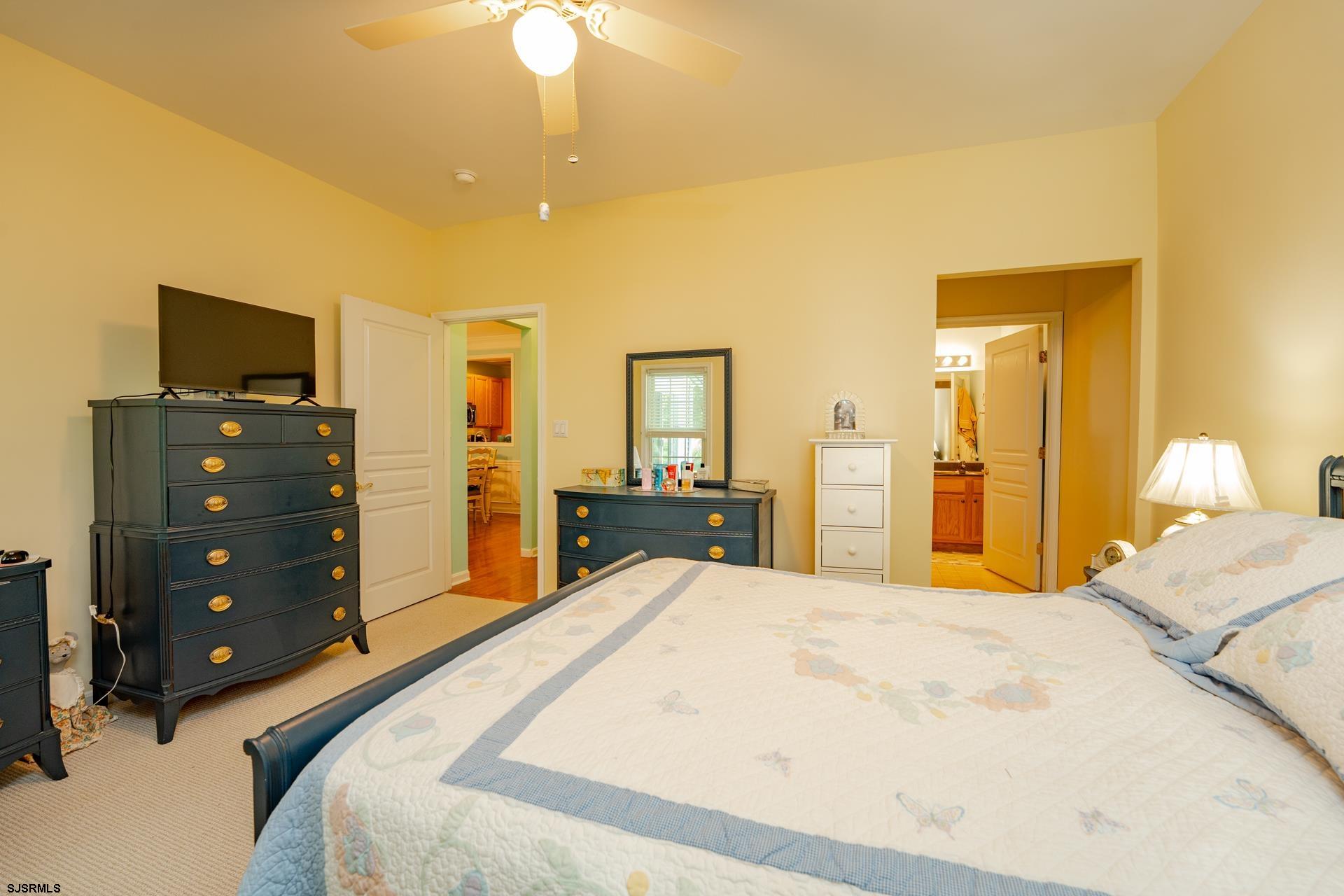 1731 Highway 9, Unit 28 Ocean View, NJ 08230 - Photo 20 of 41 a bedroom with a bed and a flat screen tv