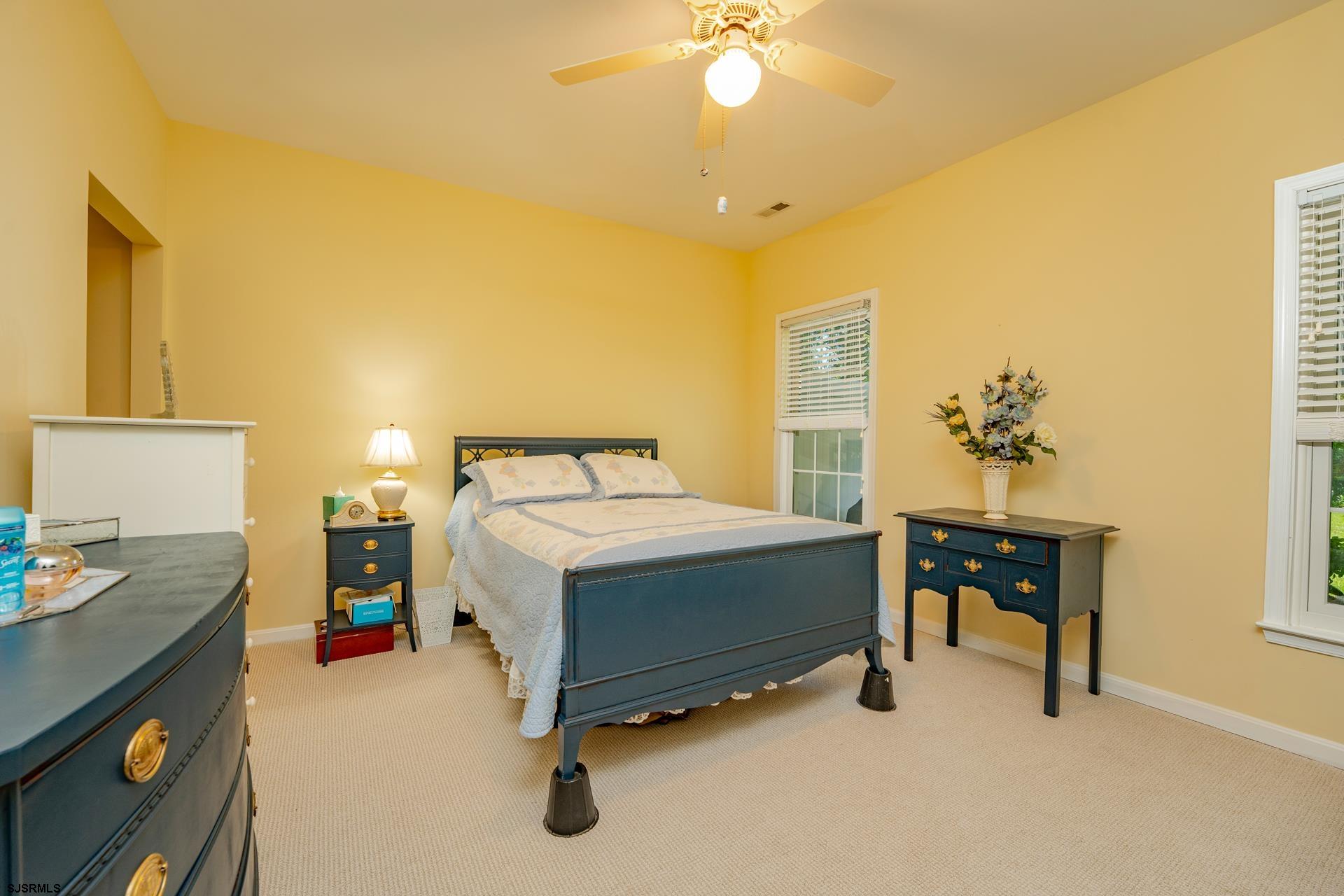 1731 Highway 9, Unit 28 Ocean View, NJ 08230 - Photo 21 of 41 a bedroom with a bed and a table