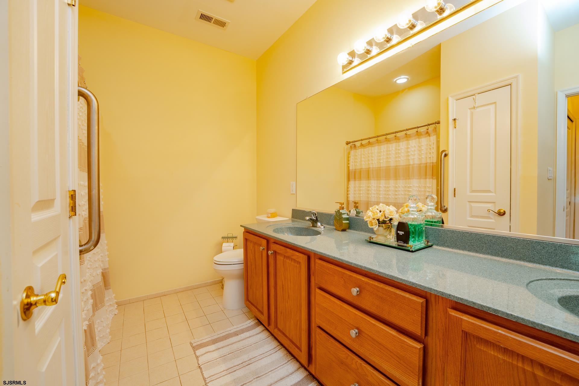1731 Highway 9, Unit 28 Ocean View, NJ 08230 - Photo 26 of 41 a spacious bathroom with a granite countertop sink mirror and a bathtub