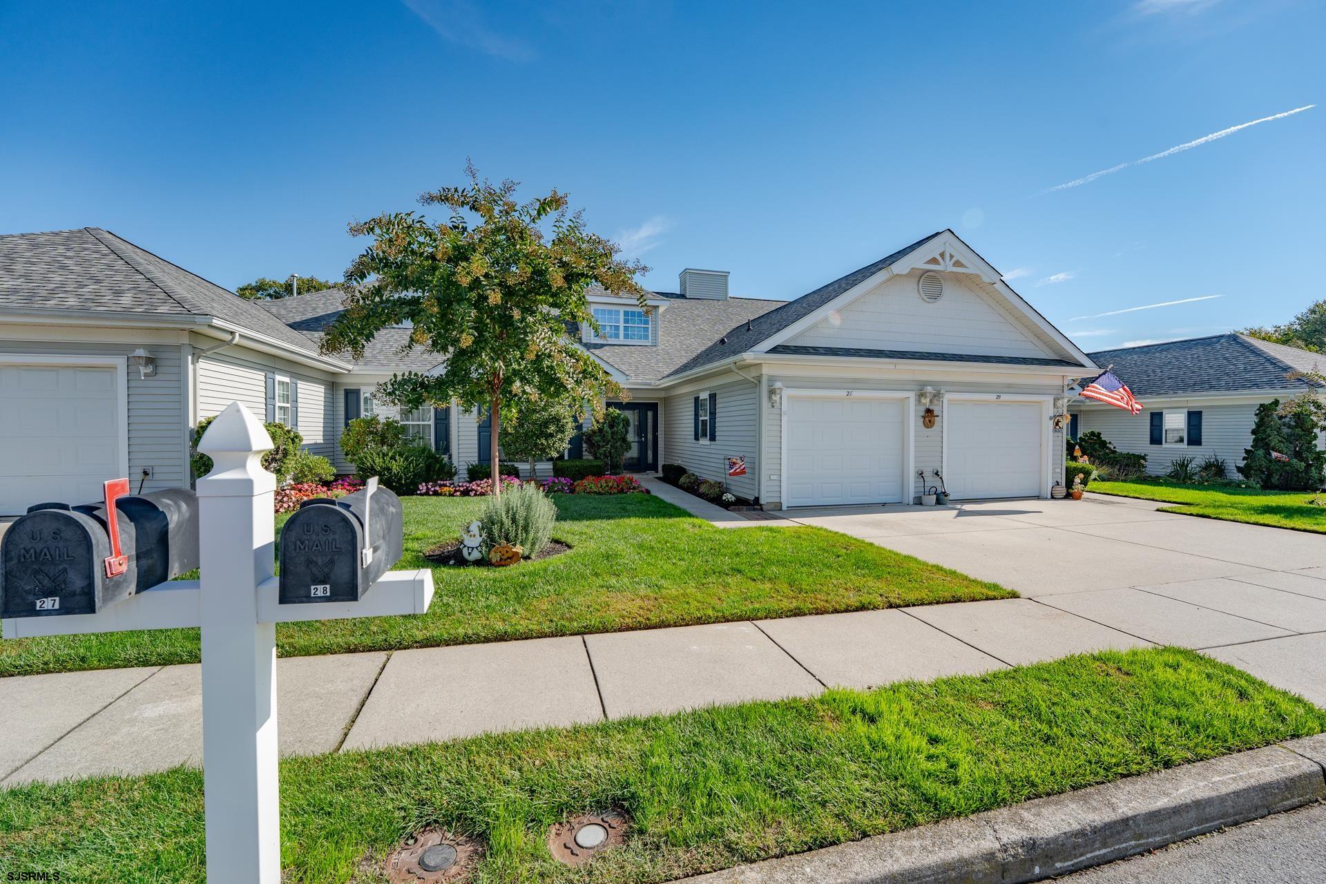 1731 Highway 9, Unit 28 Ocean View, NJ 08230 - Photo 3 of 41 a front view of a house with a yard and potted plants