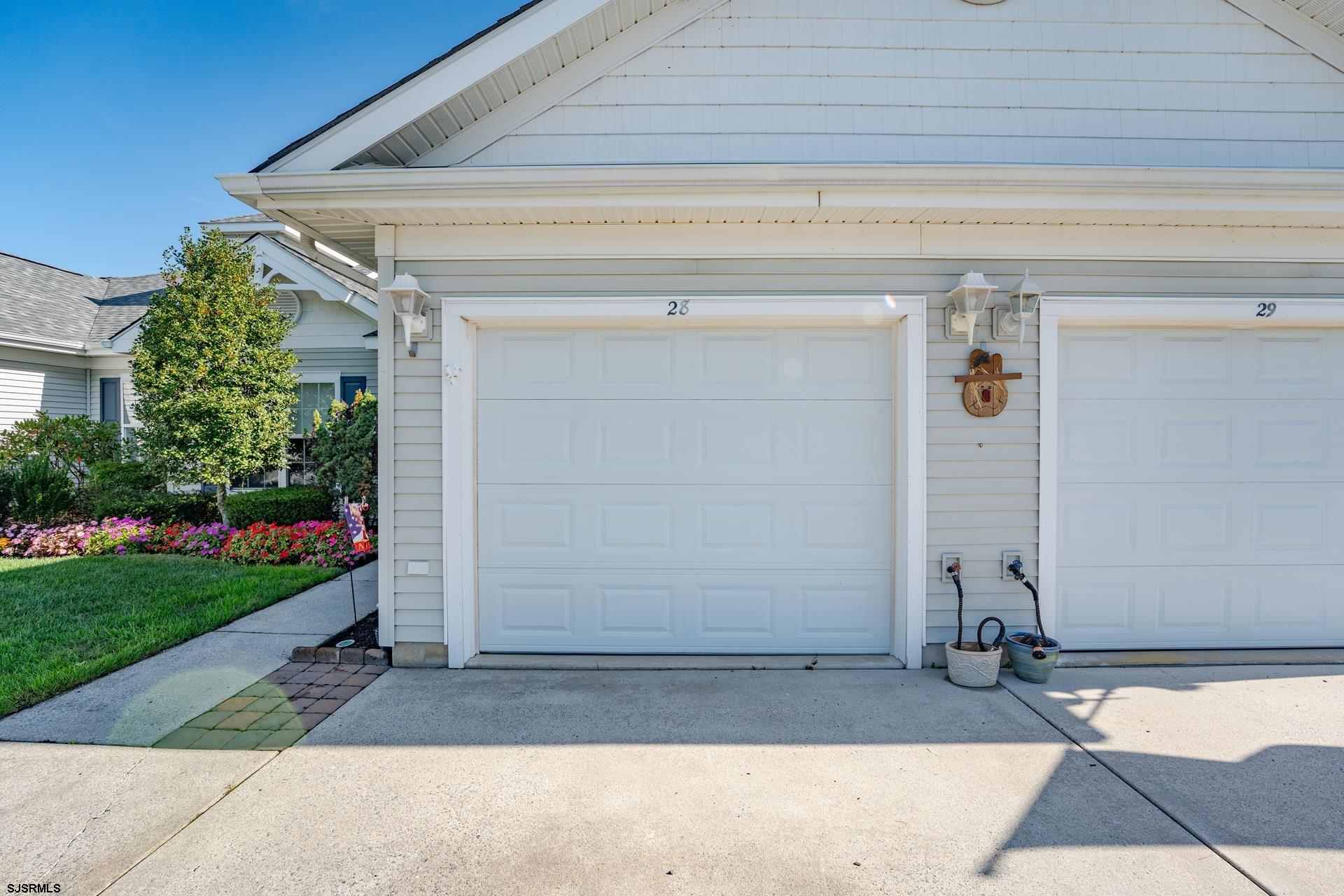 1731 Highway 9, Unit 28 Ocean View, NJ 08230 - Photo 37 of 41 a front view of a house with a yard and garage