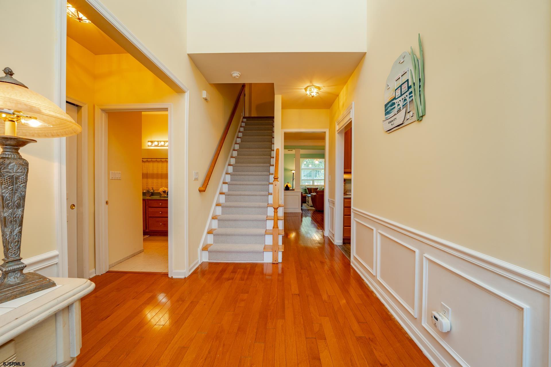1731 Highway 9, Unit 28 Ocean View, NJ 08230 - Photo 9 of 41 a view of a hallway with wooden floor and staircase