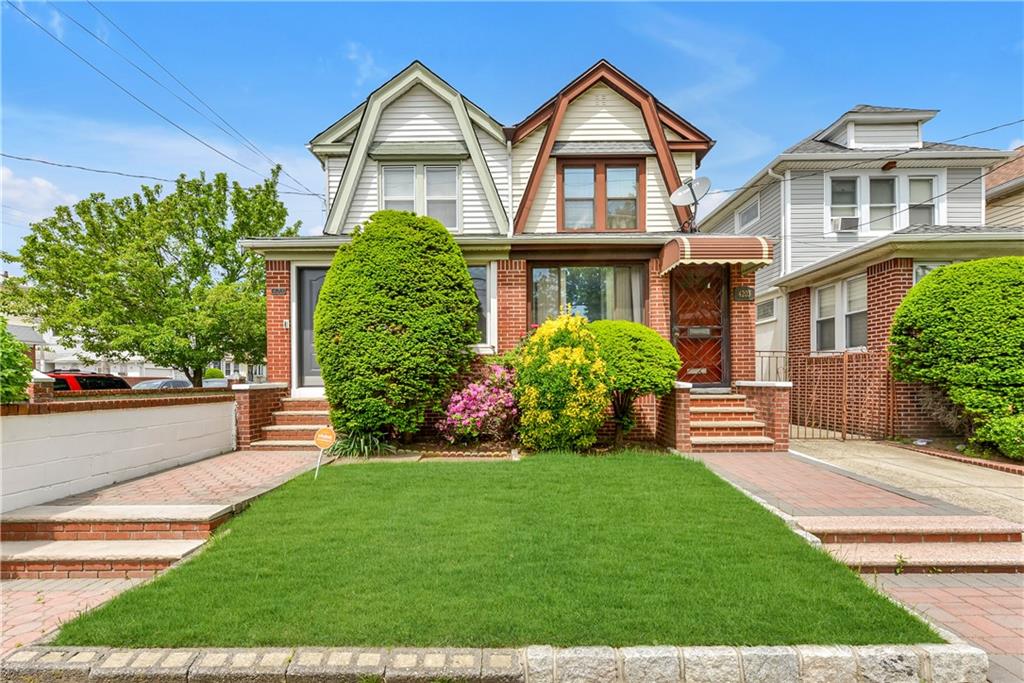 4203 Avenue I Brooklyn, NY 11210 - Photo 1 of 19 a front view of a house with a yard and potted plants