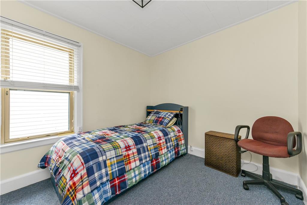 4203 Avenue I Brooklyn, NY 11210 - Photo 11 of 19 a bedroom with a bed and a window