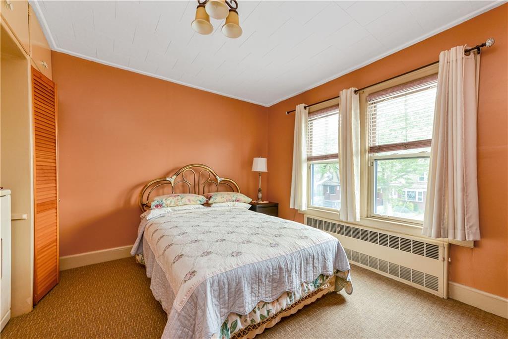 4203 Avenue I Brooklyn, NY 11210 - Photo 12 of 19 a bedroom with a bed and a window