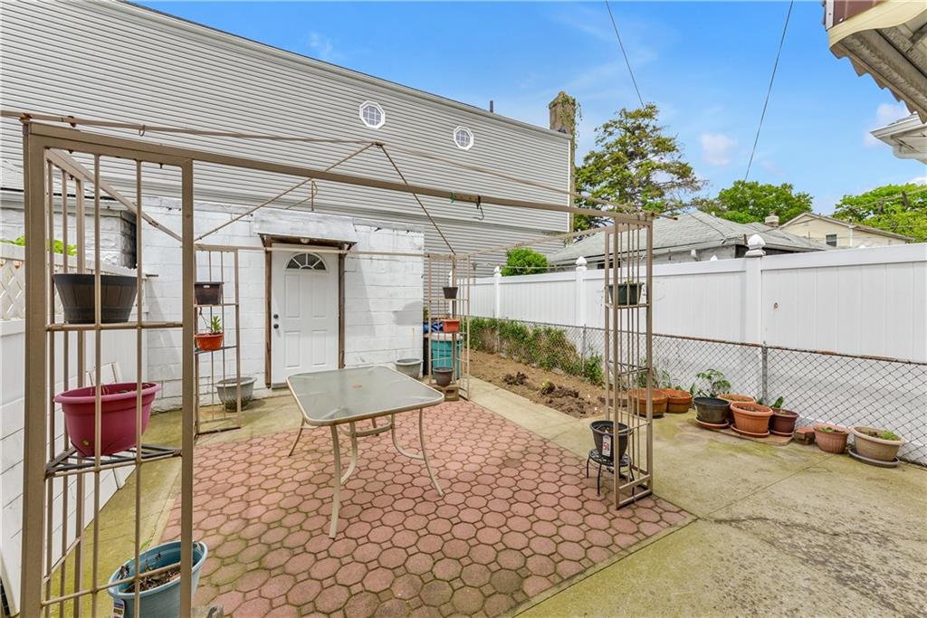 4203 Avenue I Brooklyn, NY 11210 - Photo 17 of 19 a view of a porch with a table and chairs