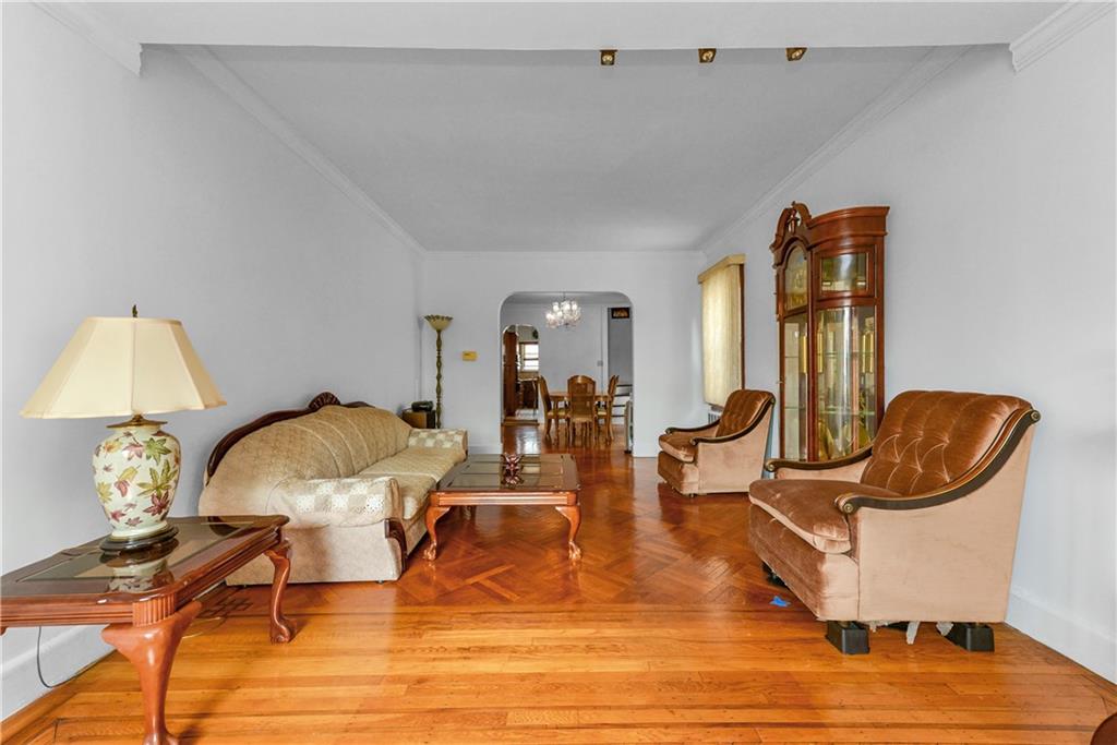4203 Avenue I Brooklyn, NY 11210 - Photo 3 of 19 a living room with furniture rug and wooden floor