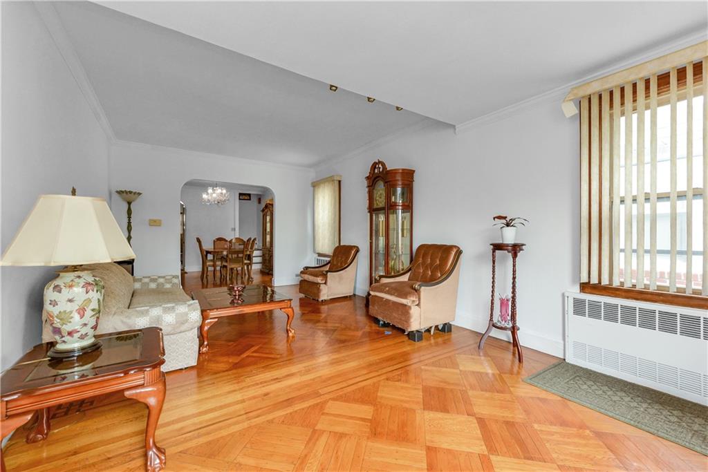 4203 Avenue I Brooklyn, NY 11210 - Photo 4 of 19 a living room with furniture a table and a window