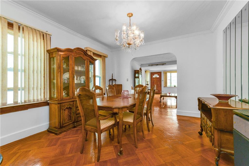 4203 Avenue I Brooklyn, NY 11210 - Photo 5 of 19 a view of a dining room with furniture and a chandelier
