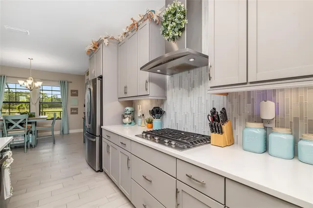 a kitchen with a sink and a refrigerator