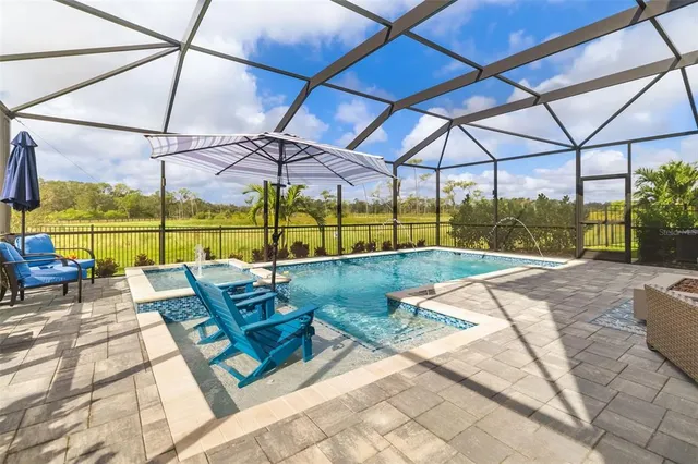 a view of a swimming pool with a patio