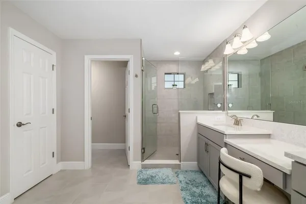 a bathroom with a double vanity sink and a mirror