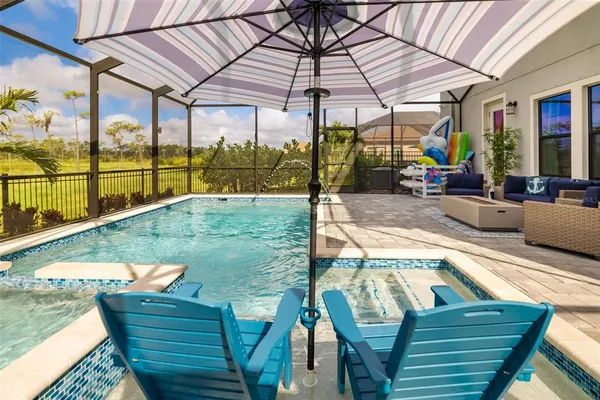 a view of a chairs and table in the balcony