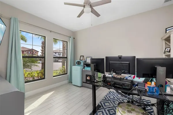 a bedroom with furniture and a flat screen tv