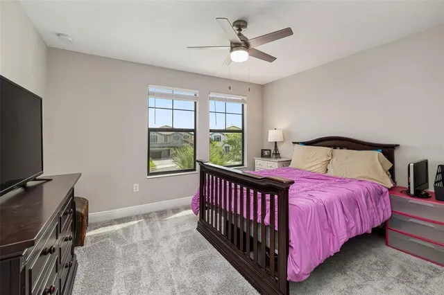 a bedroom with furniture and a chandelier