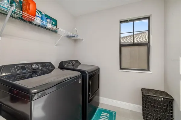 a living room with furniture and a gym equipment