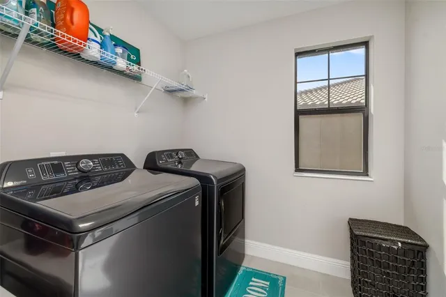 a living room with furniture and a gym equipment