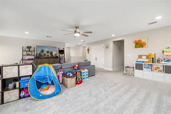 a bedroom with a bed and a book shelf