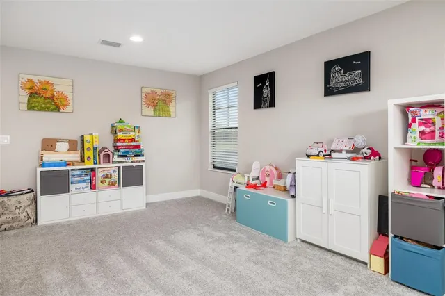 a bathroom with a sink vanity mirror and toilet