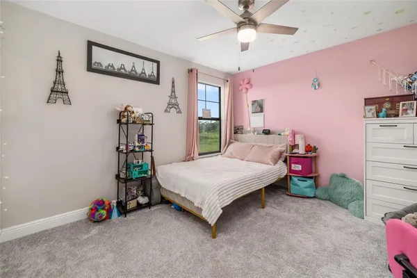 a view of a house with pool and chairs