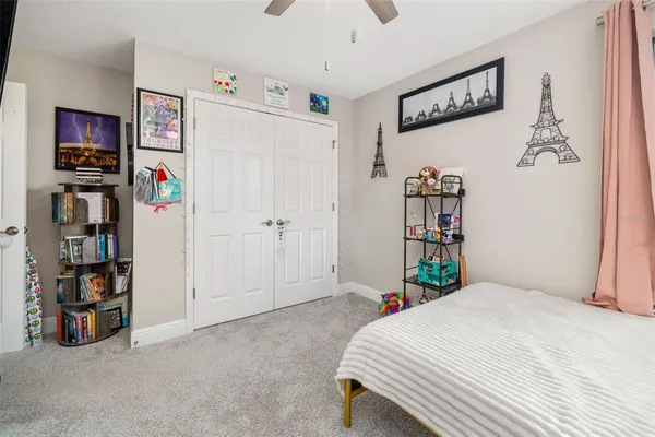 an aerial view of residential houses with outdoor space and swimming pool