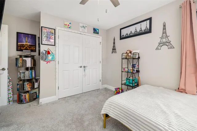 an aerial view of residential houses with outdoor space and swimming pool