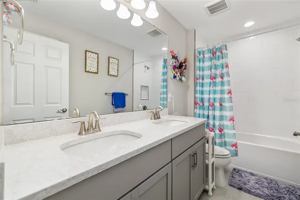 an aerial view of a house with a ocean view