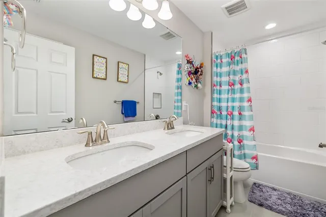 an aerial view of a house with a ocean view