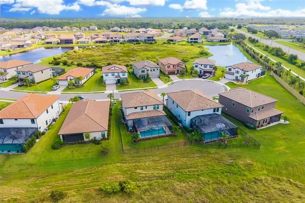 a view of a patio with a table and chairs under an umbrella